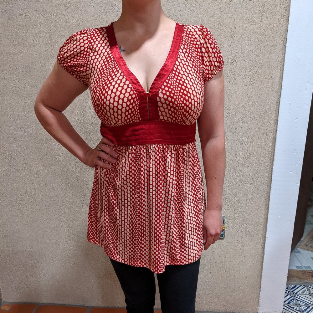 V-neck red and cream colored top